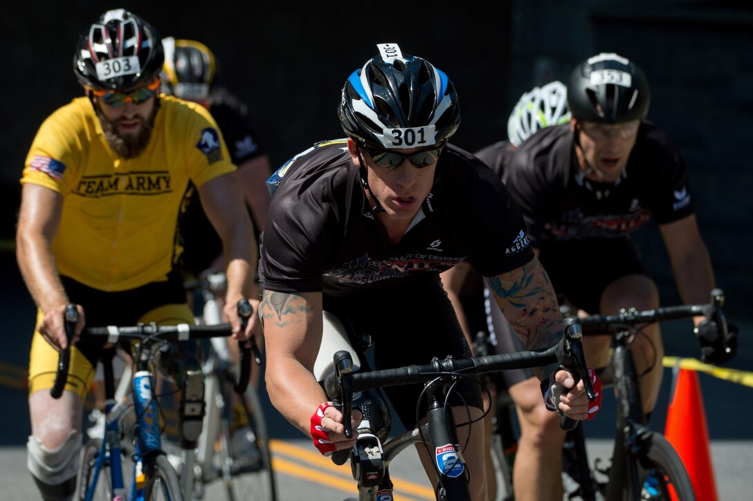 Army Sgt. 1st Class Allan Armstrong races on the 2016 Department of Defense Warrior Games cycling course at the U.S. Military Academy in West Point, N.Y., June 18, 2016. DoD photo by EJ Hersom