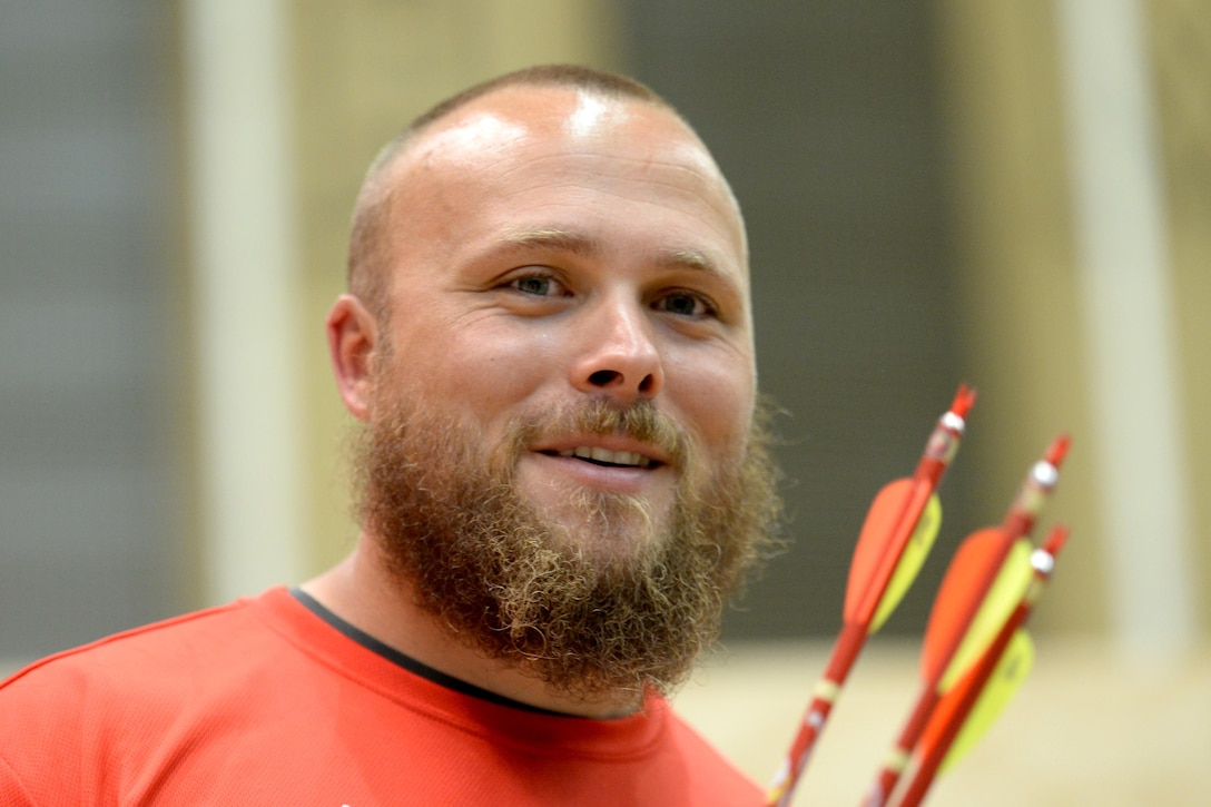 Marine Corps veteran Clayton McDaniel reacts to his score in archery during the 2016 Department of Defense Warrior Games at the U.S. Military Academy in West Point, N.Y., June 17, 2016. DoD photo by Roger Wollenberg