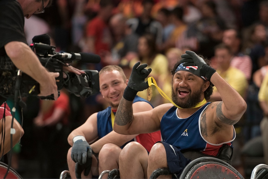 Air Force veteran Leonard Anderson, left, and U.S. Special Operations Command veteran Sualauvi Tuimaoealiiifamo celebrate after the U.S. rugby team defeated Denmark to win the gold medal.