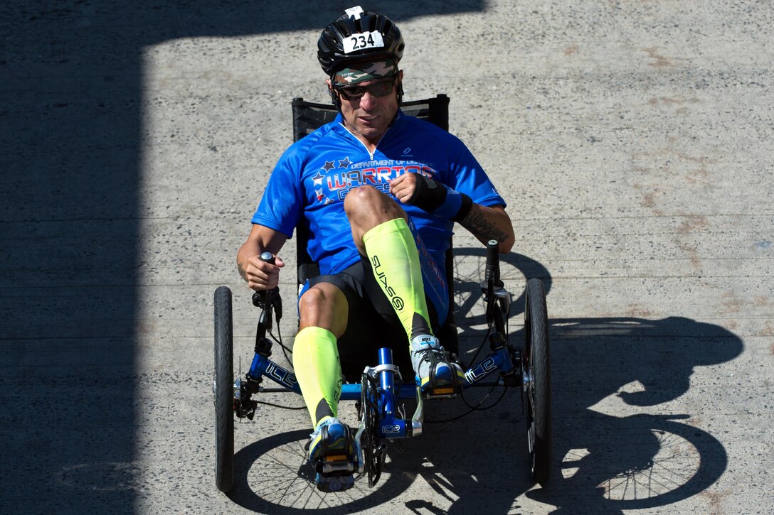 Air Force veteran Rafael Sanchez-Romero races a recumbent cycle during the 2016 Department of Defense Warrior Games at the U.S. Military Academy in West Point, N.Y., June 18, 2016. DoD photo by EJ Hersom