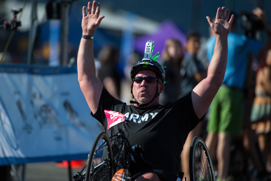 Army 1st Lt. Christopher Parks crosses the finish line during the hand cycling competition at the 2016 Department of Defense Warrior Games at the U.S. Military Academy in West Point, N.Y., June 18, 2016. DoD photo by EJ Hersom