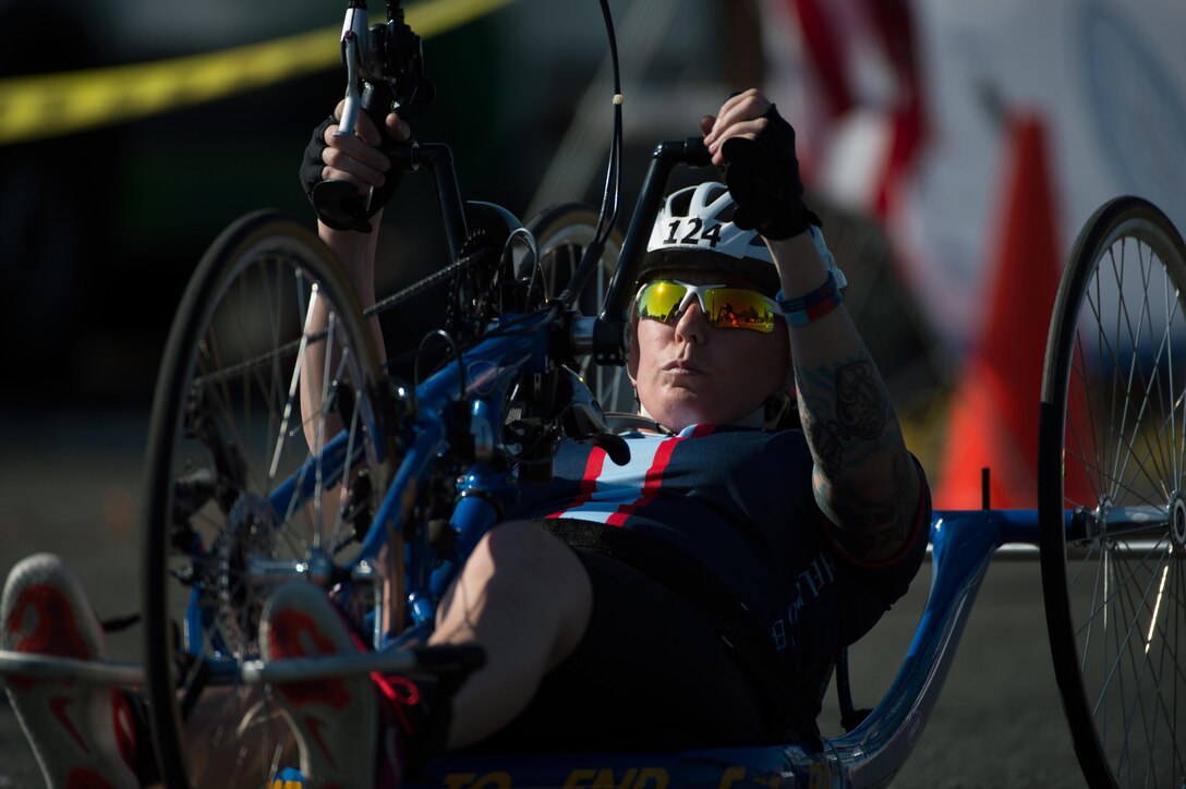 British army veteran Danielle Hampson-Carroll crosses the finish line of the 2016 Department of Defense Warrior Games cycling course at the U.S. Military Academy in West Point, N.Y., June 18, 2016. DoD photo by EJ Hersom
