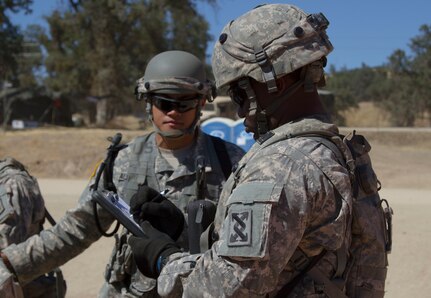 U.S. Army Reserve Spc. Jahvar Billings, 385th Transportation Detachment, Fort Bragg, N.C., verifies a trip ticket for a Soldier, 812th Military Police Company, Orangeburg, N.Y., at Tactical Assembly Area Schoonover during Combat Support Training Exercise 91-16-02, Fort Hunter Liggett, Calif., June 15, 2016. As the largest U.S. Army Reserve training exercise, CSTX 91-16-02 provides Soldiers with unique opportunities to sharpen their technical and tactical skills in combat-like conditions. (Photo by U.S. Army Spc. Daisy Zimmer, 367th Mobile Public Affairs Detachment)