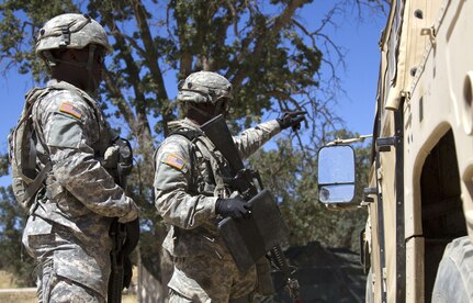 U.S. Army Reserve Spcs. Jahvar Billings and Anthony Clark, 385th Transportation Detachment, Fort Bragg, N.C., guide a Humvee driver to the exit point at Tactical Assembly Area Schoonover during Combat Support Training Exercise 91-16-02, Fort Hunter Liggett, Calif., June 15, 2016. As the largest U.S. Army Reserve training exercise, CSTX 91-16-02 provides Soldiers with unique opportunities to sharpen their technical and tactical skills in combat-like conditions. (Photo by U.S. Army Spc. Daisy Zimmer, 367th Mobile Public Affairs Detachment)