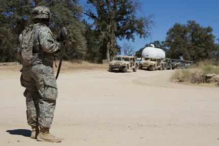 U.S. Army Reserve Spc. Christopher Payton, 385th Transportation Detachment, Fort Bragg, N.C., awaits a departing convoy at Tactical Assembly Area Schoonover during Combat Support Training Exercise 91-16-02, Fort Hunter Liggett, Calif., June 15, 2016. As the largest U.S. Army Reserve training exercise, CSTX 91-16-02 provides Soldiers with unique opportunities to sharpen their technical and tactical skills in combat-like conditions. (Photo by U.S. Army Spc. Daisy Zimmer, 367th Mobile Public Affairs Detachment)