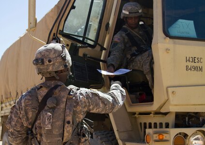 U.S. Army Reserve Spc. Jahvar Billings, 385th Transportation Detachment, Fort Bragg, N.C., accepts a trip ticket at Tactical Assembly Area Schoonover during Combat Support Training Exercise 91-16-02, Fort Hunter Liggett, Calif., June 15, 2016. As the largest U.S. Army Reserve training exercise, CSTX 91-16-02 provides Soldiers with unique opportunities to sharpen their technical and tactical skills in combat-like conditions. (Photo by U.S. Army Spc. Daisy Zimmer, 367th Mobile Public Affairs Detachment)