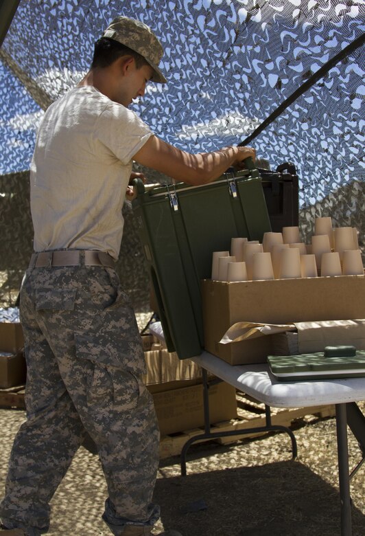 U.S. Army Reserve Spc. Joseph Kim, Nutrition Care Specialist, 349th Combat Support Hospital, Bell, Calif., prepares to clean a cold drink container at Tactical Assembly Area Schoonover during Combat Support Training Exercise 91-16-02, Fort Hunter Liggett, Calif., June 17, 2016. As the largest U.S. Army Reserve training exercise, CSTX 91-16-02 provides Soldiers with unique opportunities to sharpen their technical and tactical skills in combat-like conditions. (U.S. Army photo by Spc. Daisy Zimmer, 367th Mobile Public Affairs Detachment)