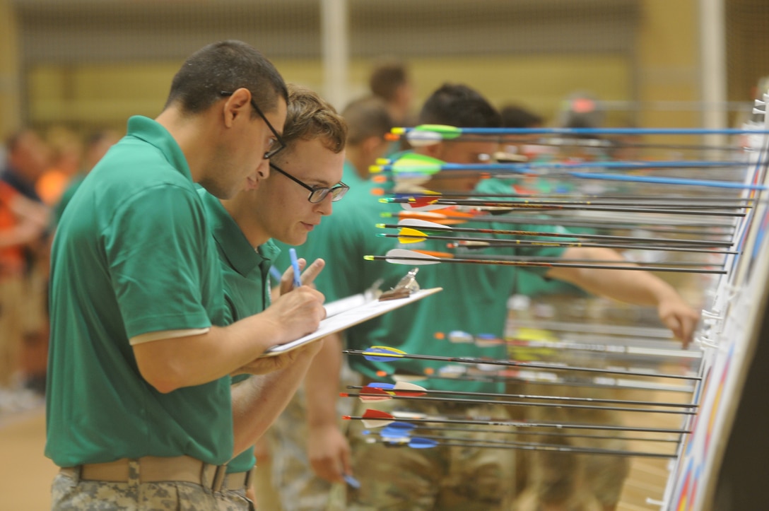 The 2016 DoD Warrior Games includes archery, both recurve bow and compound bow. The Games, running from June 15-21,  are a Paralympic-type event for wounded, ill and injured personnel from the military representing all four U.S. Services, Special Operations Command and the United Kingdom. Pictured here, scorers determine the points scored after a round of arrows have been shot.