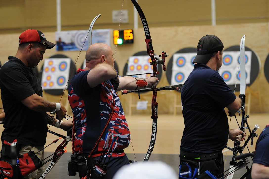The 2016 DoD Warrior Games includes archery, both recurve bow, seen here, compound bow. The competitor in the red, white abd blue shirts are from the United Kingdom team. The Games, running from June 15-21,  are a Paralympic-type event for wounded, ill and injured personnel from the military representing all four U.S. Services, Special Operations Command and the United Kingdom.