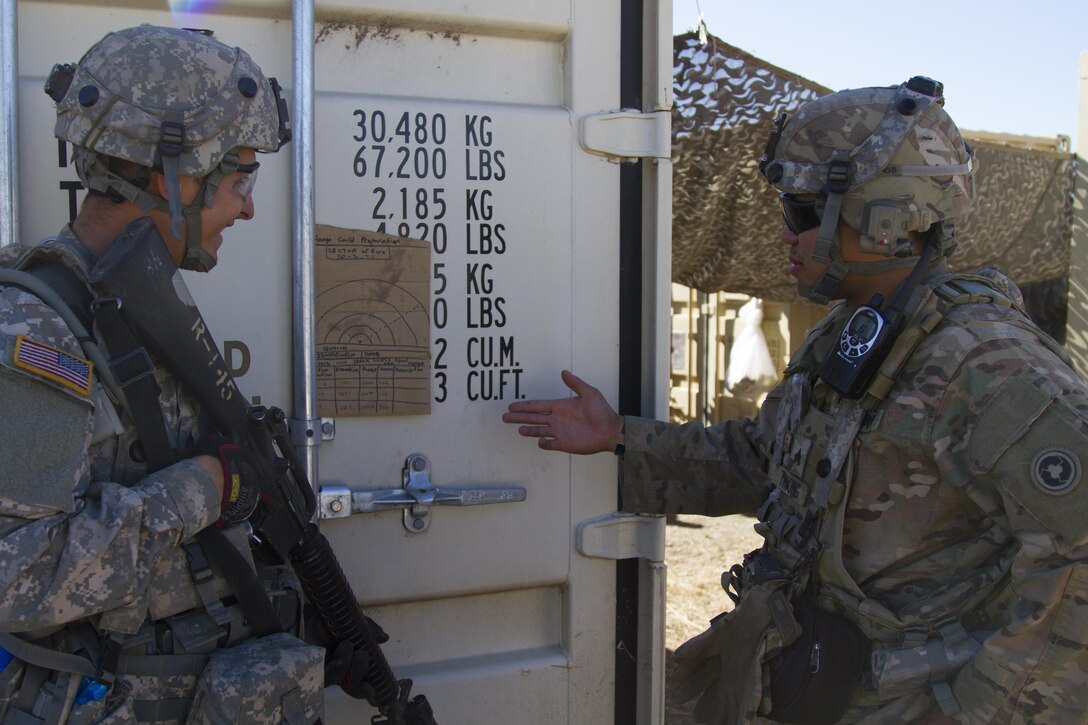U.S. Army Reserve Sgt. Kevin Troung, 1017th Quartermaster Company, Camp Pendleton, Calif., reviews a range card with Sgt. Eric Terrill as part of a defense scenario at Tactical Assembly Area Schoonover fuel point during Combat Support Training Exercise 91-16-06, Fort Hunter Liggett, Calif., June 17, 2016. As the largest U.S. Army Reserve training exercise, CSTX 91-16-02 provides Soldiers with unique opportunities to sharpen their technical and tactical skills in combat-like conditions. (U.S. Army photo by Spc. Daisy Zimmer, 367th Mobile Public Affairs Detachment)