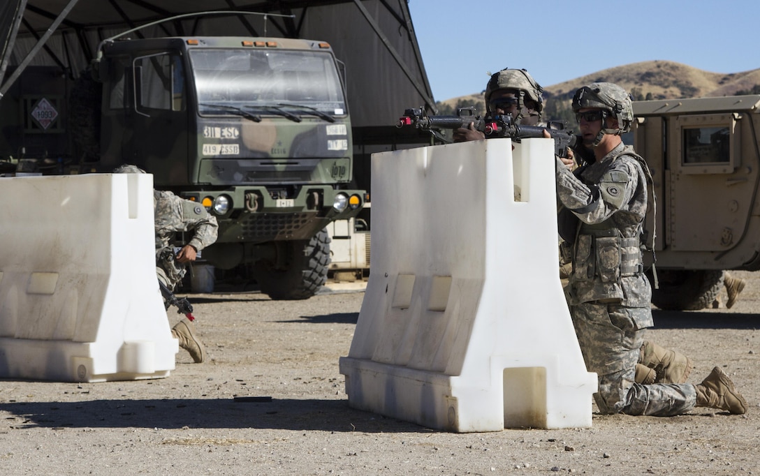 U.S. Army Reserve Soldiers, 1017th Quartermaster Company, Camp Pendleton, Calif., react to a simulated attack during a defense exercise at the Tactical Assembly Area Schoonover fuel point as part of Combat Support Training Exercise 91-16-02, Fort Hunter Liggett, Calif., June 17, 2016. As the largest U.S. Army Reserve training exercise, CSTX 91-16-02 provides Soldiers with unique opportunities to sharpen their technical and tactical skills in combat-like conditions. (U.S. Army photo by Spc. Daisy Zimmer, 367th Mobile Public Affairs Detachment)