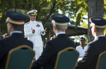 Rear Adm. James Helis, superintendent of the U.S. Merchant Marine Academy, speaks to six midshipmen about to commission into the U.S. Army in Kings Point, New York, during a private commissioning ceremony June 18. Maj. Gen. Phillip Churn, commanding general of 200th Military Police Command, U.S. Army Reserve, a native of Washington, D.C., administered the Oath of Commissioned Officers for the Army lieutenants. Three of the lieutenants joined the engineering branch in the U.S. Army Reserve and will belong to the 306th Engineer Company (Vertical), belonging to the 412th Theater Engineer Command. (U.S. Army photo by Master Sgt. Michel Sauret)