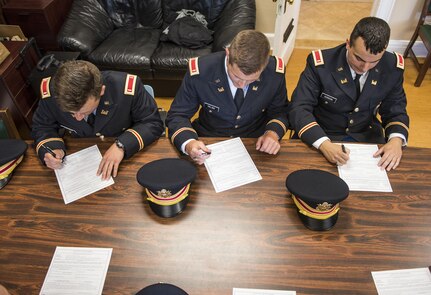 A group of newly commissioned U.S. Army lieutenants sign the Oath of Office at the U.S. Merchant Marine Academy in Kings Point, New York, June 18. The three officers pictured here all joined the engineering branch in the U.S. Army Reserve and will belong to the 306th Engineer Company (Vertical), belonging to the 412th Theater Engineer Command. The 2016 graduating class included 229 senior midshipmen, each earning a Bachelor of Science degree, a direct commission into the armed forces and a U.S. Coast Guard license. (U.S. Army photo by Master Sgt. Michel Sauret)