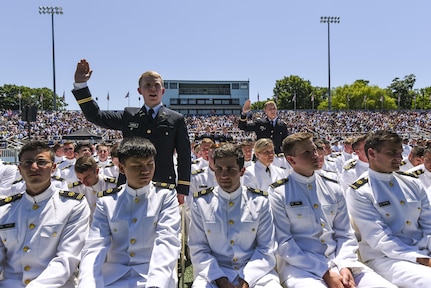 U.S. Army lieutenants take the Oath of the Commissioned Officer for the second time that day during their graduation ceremony at the U.S. Merchant Marine Academy in Kings Point, New York, June 18. Maj. Gen. Phillip Churn, commanding general of the 200th Military Police Command, U.S. Army Reserve, a native of Washington, D.C., administered the Oath of Commissioned Officers for six Army lieutenants. The 2016 graduating class included 229 senior midshipmen, each earning a Bachelor of Science degree, a direct commission into the armed forces and a U.S. Coast Guard license. (U.S. Army photo by Master Sgt. Michel Sauret)