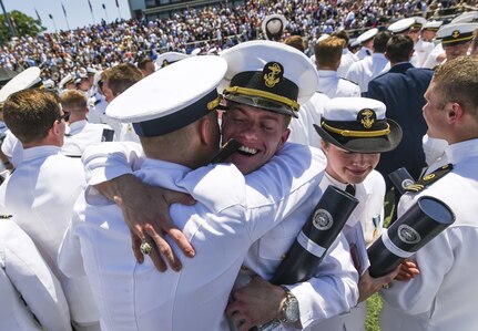 Newly commissioned ensigns cheer and congratulate one another after graduating from the U.S. Merchant Marine Academy in Kings Point, New York, June 18. The 2016 graduating class included 229 senior midshipmen, each earning a Bachelor of Science degree, a direct commission into the armed forces and a U.S. Coast Guard license. (U.S. Army photo by Master Sgt. Michel Sauret)