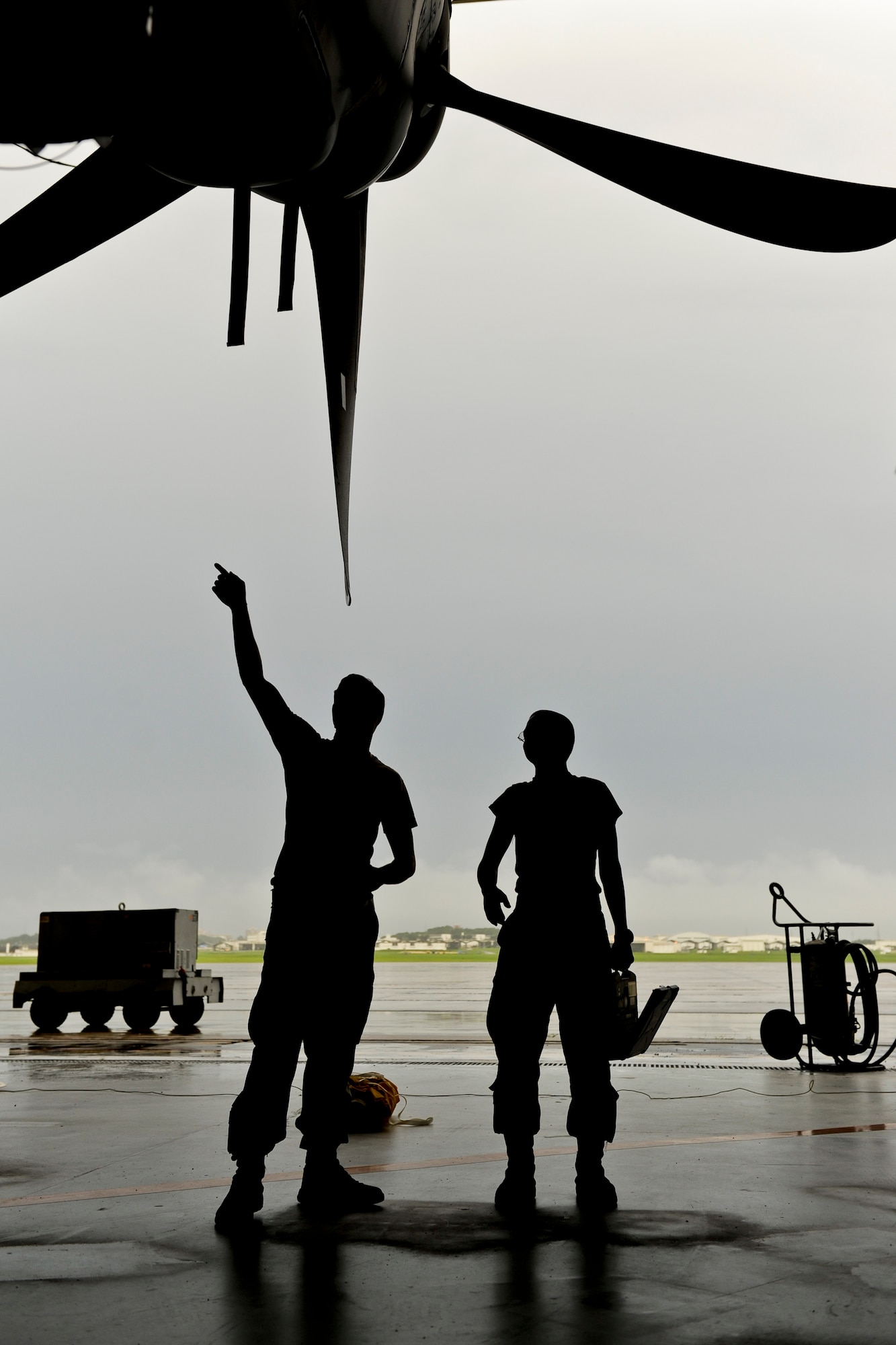 U.S. Air Force Senior Airman Shaun Smith and Airman 1st Class Michael Blocher, both 353rd Special Operations Maintenance  Squadron MC-130J Commando II crew chiefs, check MC-130J propellers during a home station inspection June 13, 2016, at Kadena Air Base, Japan. Upon return from an extended mission, the aircraft undergoes a rigorous inspection of all systems to ensure the safety of aircrews. (U.S. Air Force photo by Senior Airman Peter Reft)