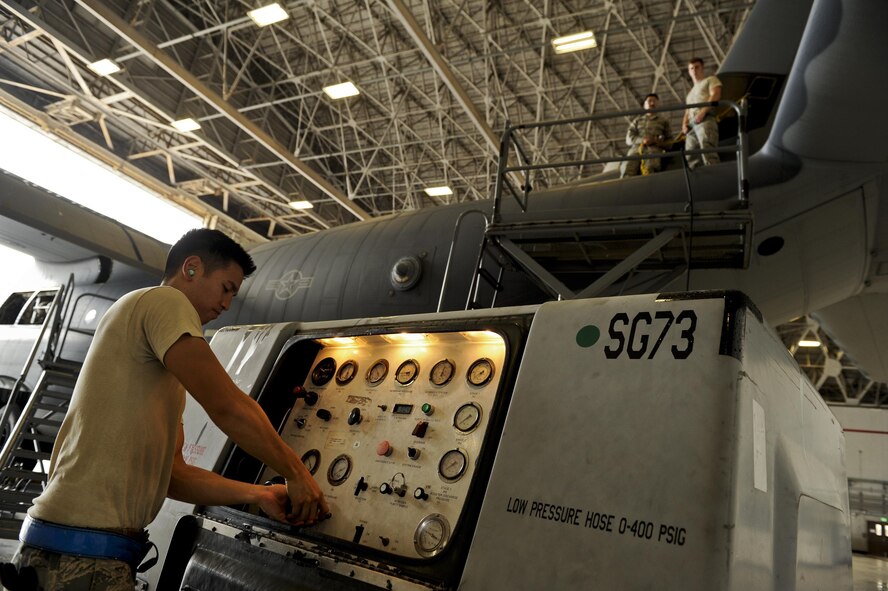 U.S. Air Force Staff Sgt. Dylan Daguay, 353rd Special Operations Maintenance Squadron electrical and environmental specialist, operates a nitrogen cart during a de-icing boot pressure testing June 13, 2016, at Kadena Air Base, Japan. The pressure test ensured proper operation of de-icing components in the vertical stabilizer of an MC-130J Commando II. (U.S. Air Force photo by Senior Airman Peter Reft)