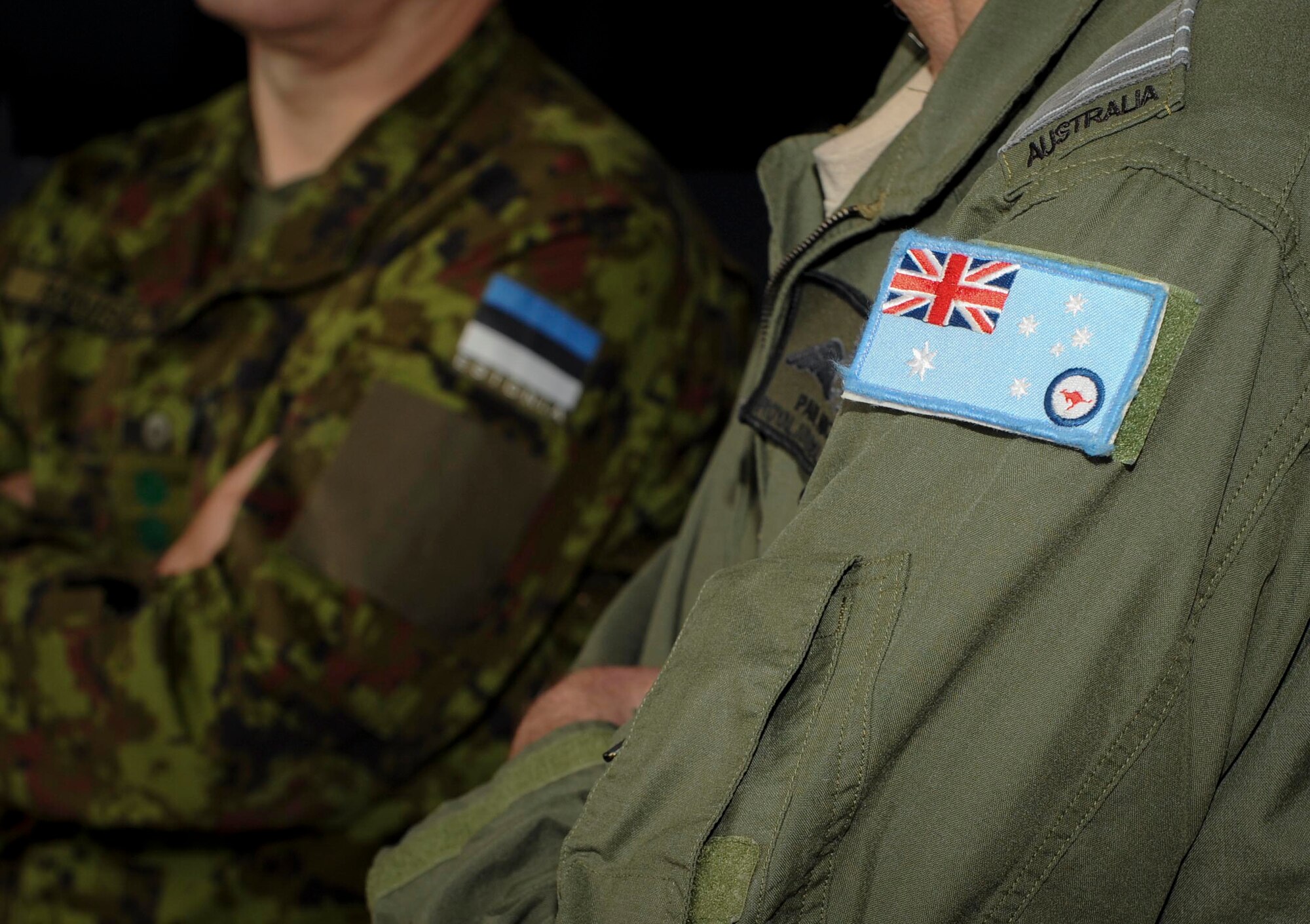 An Australian flag patch rests on the shoulder of a defense attaché member at RAF Fairford, United Kingdom, June 17, 2016. During their visit, the attaché members learned about B-52 capabilities and discussed the aircraft’s role in multinational exercises BALTOPS 16 and Saber Strike 16. (U.S. Air Force photo/Senior Airman Sahara. L. Fales)