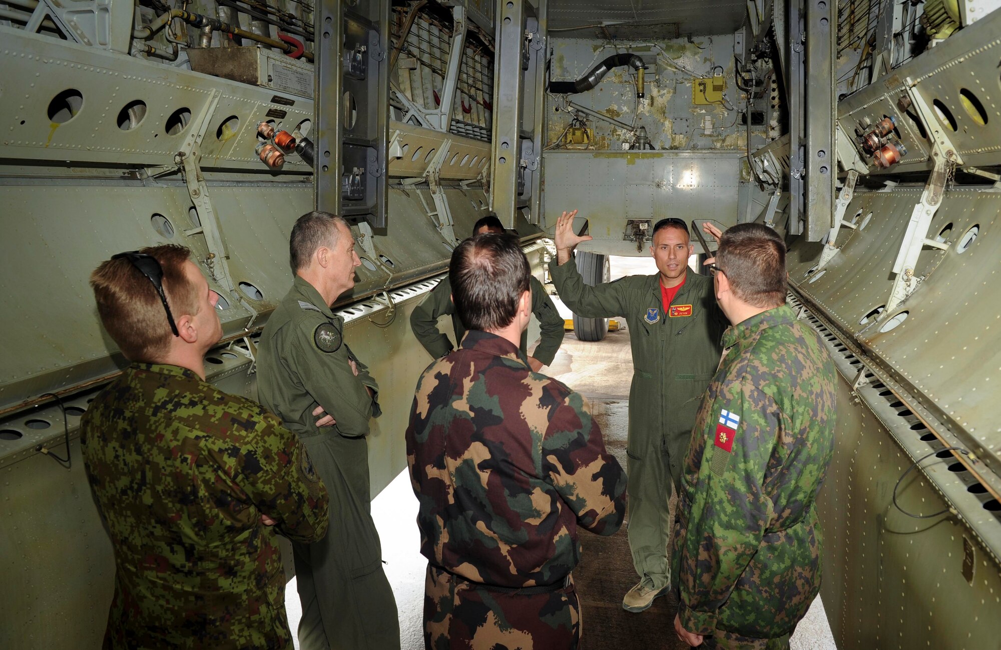 U.S. Air Force Lt. Col. Mike Maginness, 23rd Expeditionary Bomb Squadron commander, shows Defense attaché members the bomb bay of a B-52H Stratofortress at RAF Fairford, United Kingdom, June 17, 2016. Defense attaché members represented various countries such as Australia, Hungary, Estonia and Finland. (U.S. Air Force photo/Senior Airman Sahara L. Fales)