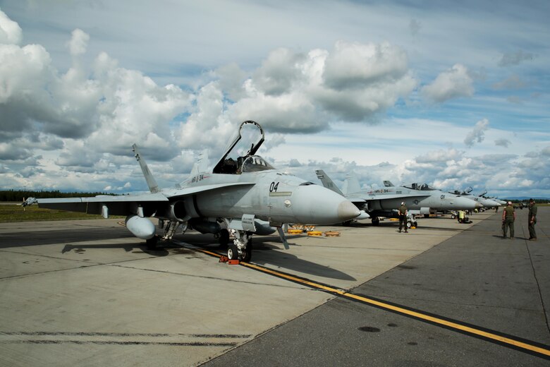 U.S. Marine Corps F/A-18C Hornet aircraft with Marine Fighter Attack Squadron (VMFA) 314, stationed at Marine Corps Air Station Miramar, California, stage for a mission at Eielson Air Force Base, Alaska, during its participation in Red Flag-Alaska 16-2, June 7, 2016. Red Flag-Alaska 16-2 provides squadrons the opportunity to train with joint and international units, increasing their combat skills by participating in simulated combat situations in a realistic threat environment. (U.S. Marine Corps photo by Lance Cpl. Donato Maffin/Released)