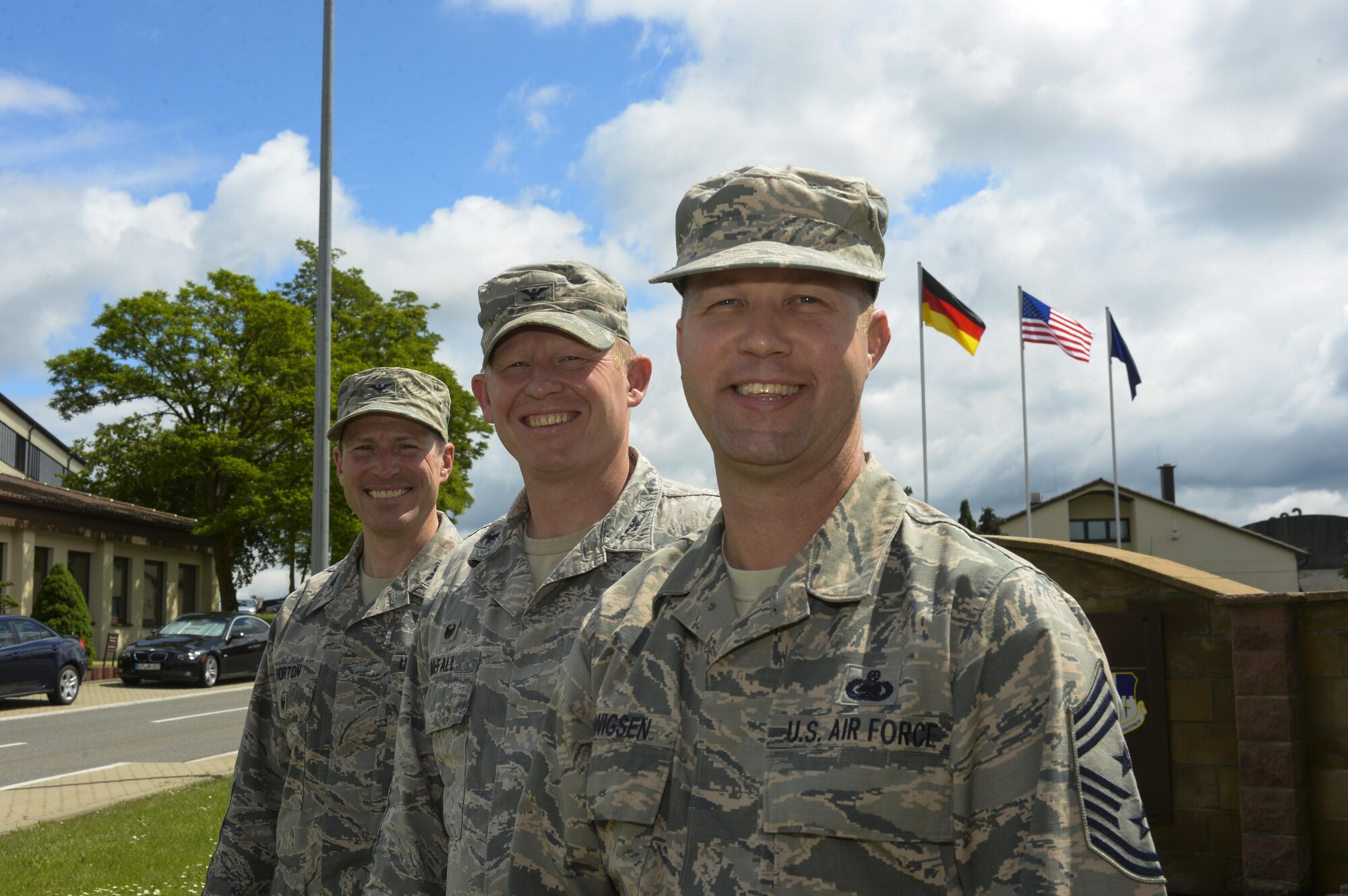 U.S. Air Force Chief Master Sgt. Edwin Ludwigsen, 52nd Fighter Wing command chief, right, poses next to U.S. Air Force Col. Joe McFall, 52nd FW commander, center, and U.S. Air Force Col. Steven Horton, 52nd FW vice commander, left, outside of wing headquarters in Spangdahlem Air Base, Germany, June 2, 2016. Ludwigsen assumed the command chief position May 22, 2016, from outgoing command chief, U.S. Air Force Chief Master Sgt. Brian Gates. (U.S. Air Force photo by Staff Sgt. Joe W. McFadden/Released)