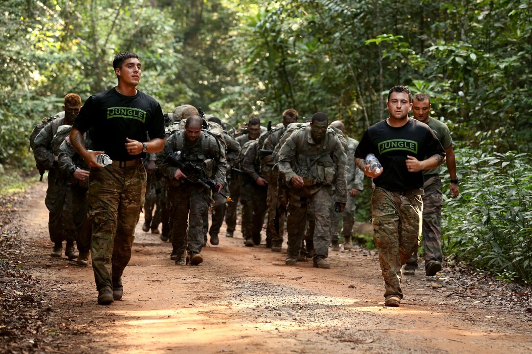 U.S. soldiers run with their French army instructors at the French jungle warfare school in Gabon, June 10, 2016. The soldiers, assigned to the 3rd Infantry Division’s Company B, 3rd Battalion, 7th Infantry Regiment, 2nd Infantry Brigade Combat Team, are attending the school as part of Central Accord 2016, a U.S. Army Africa exercise bringing together partner nations to practice and demonstrate proficiency in peacekeeping operations. Army photo by Sgt. Henrique Luiz de Holleben