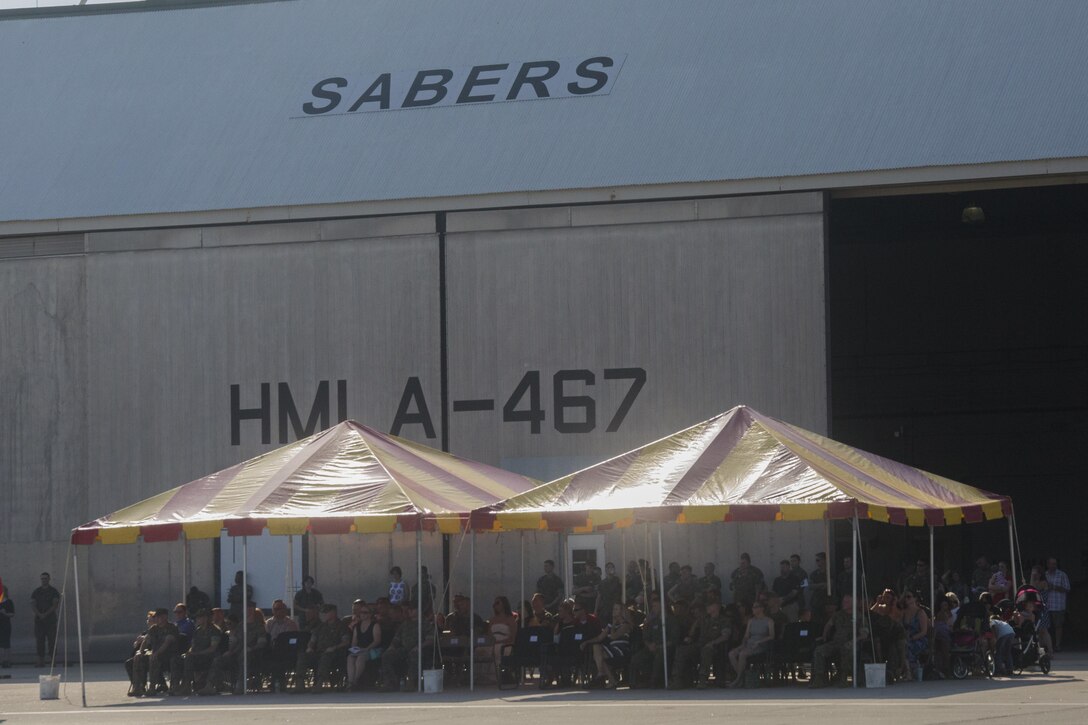 Friends and family of Marines and sailors with Marine Light Attack Helicopter Squadron 467 watch from the viewing area along the flight line during the deactivation ceremony at Marine Corps Air Station New River, N.C., June 16, 2016.  After eight years of service under 2nd Marine Air Wing and supporting the global war on terror, the unit will disband and Marines will scatter throughout various other attack squadrons throughout the Marine Corps.