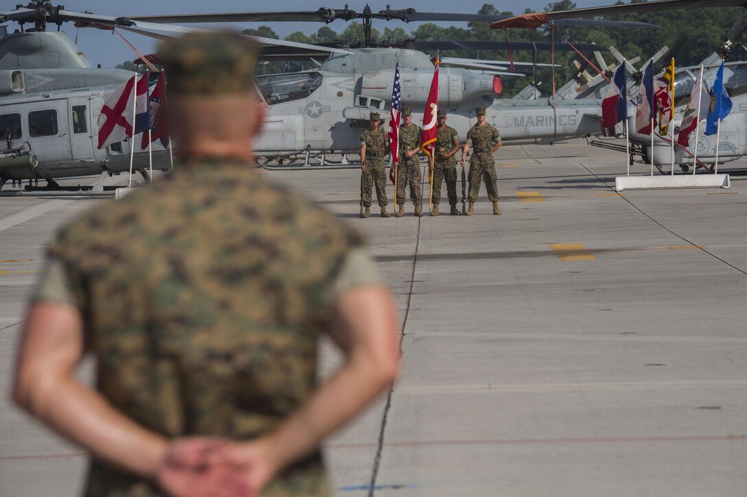 Major Steven R. Thompson, the executive officer with Marine Light Attack Helicopter Squadron 467 waits for his cue to take charge of the staff detail during the deactivation of the squadron at Marine Corps Air Station New River, N.C., June 16, 2016. HMLA-467 provided offensive air support, utility support, armed escort and airborne supporting arms coordination, day or night under all weather conditions during expeditionary, joint or combined operations.