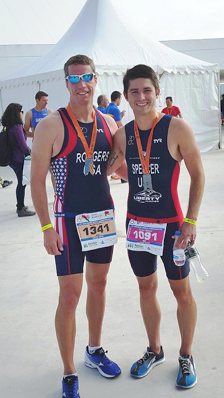 Don Rodgers, left, Defense Logistics Agency Installation Support at Richmond, Virginia’s fire chief, poses with Parker Spencer, a Richmond resident and director of Coach Operations, Endorpin Fitness, after competing June 5 in the International Triathlon Union’s Duathlon World Championship held in Avilȇs, Spain June 4 – 6, 2016. 