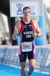 Don Rodgers, Defense Logistics Agency Installation Support at Richmond, Virginia’s fire chief, gives two thumbs up as he completes his run in the sprint distance duathlon at the International Triathlon Union’s Duathlon World Championship held in Avilȇs, Spain June 4 – 6, 2016. 