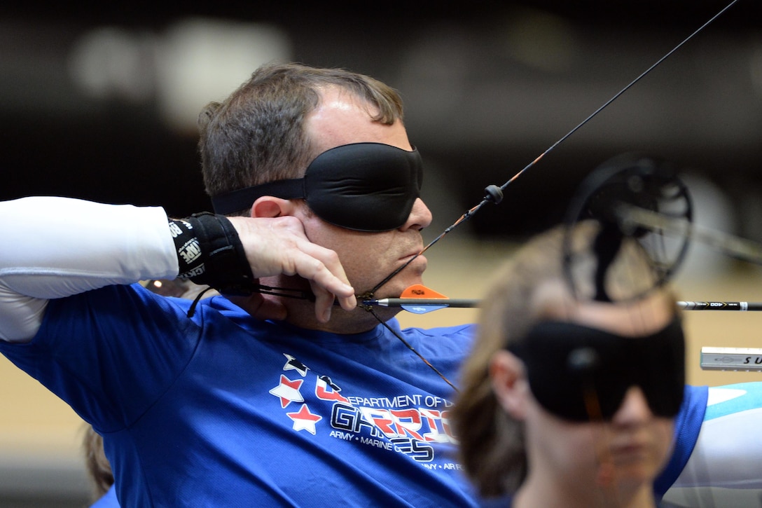 Air Force veteran Master Sgt. D. Reese Hines competes in archery for visually impaired people during the 2016 Department of Defense Warrior Games at the U.S. Military Academy in West Point, N.Y. June 17, 2016. DoD photo by EJ Hersom
