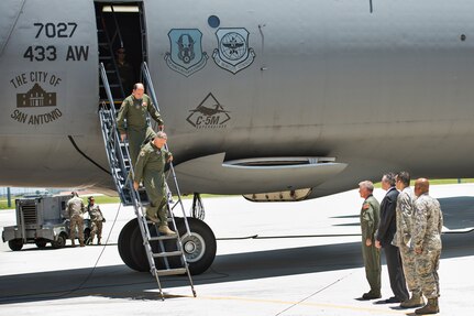 Maj. Gen. John C. Flournoy Jr., 4th Air Force commander, followed by Col. Thomas K. Smith Jr., 433rd AW commander, depart the Alamo Wing's first C-5M Super Galaxy, bestowed "The City of San Antonio" June 17, 2016 at Joint Base San Antonio-Lackland, Texas. The crew flew the maiden flight from Stewart Air National Guard Base, New York, earlier that day before their arrival at the official aircraft transfer ceremony. (U.S. Air Force photo by Benjamin Faske)