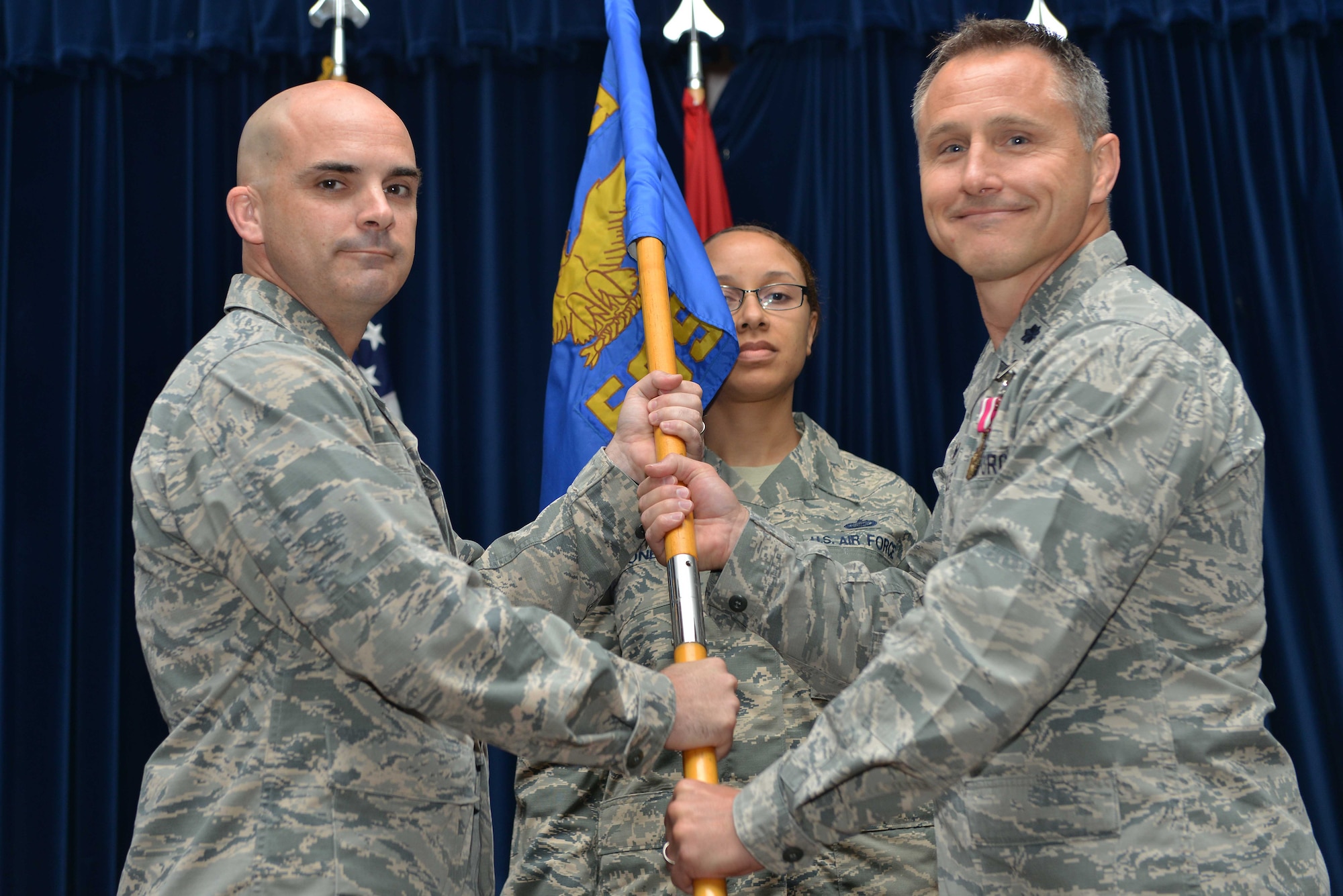 U.S. Air Force Lt. Col. Hardy Giles, 39th Force Support Squadron outgoing commander, relinquishes command to U.S. Air Force Col. Russell Voce, 39th Mission Support Group commander, during a change of command ceremony June 20, 2016, at Incirlik Air Base, Turkey. The 39th FSS provides a wide range of organizational, professional and community support to the organizations and people who live or work at Incirlik Air Base. (U.S. Air Force photo by Senior Airman John Nieves Camacho/Released)