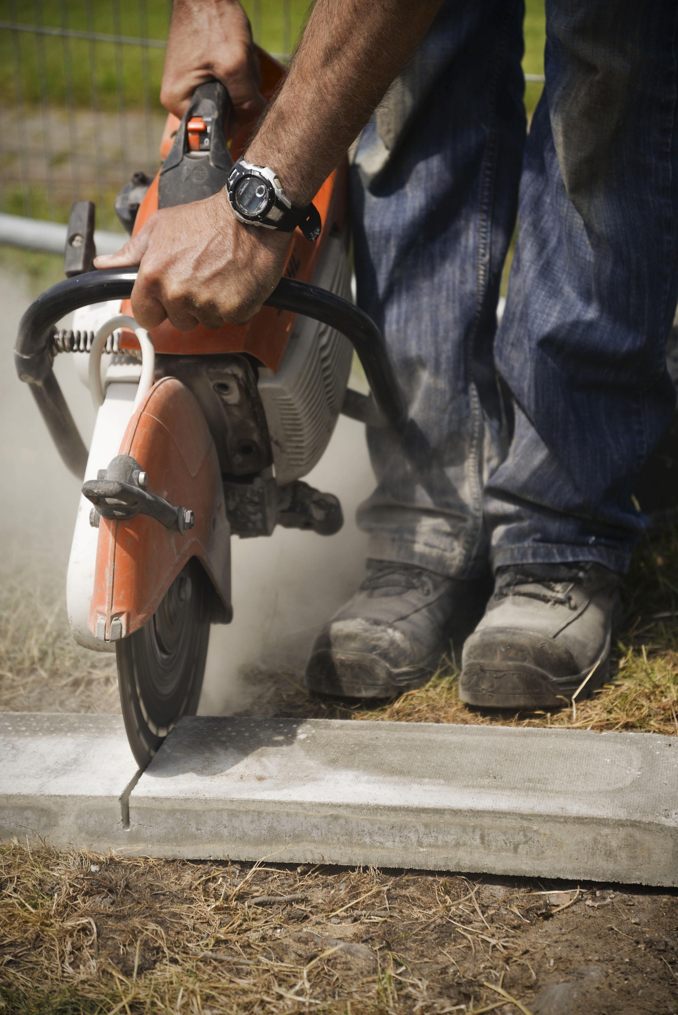 Richard Austin, 100th Civil Engineer Squadron Horizontal Pavement and Construction Equipment operator, cuts a stone brick June 8, 2016, on RAF Mildenhall, England. Airmen and civilians work all over base working on anything from fencing around the flightline to the flightline itself.(U.S. Air Force photo by Senior Airman Christine Halan/Released)