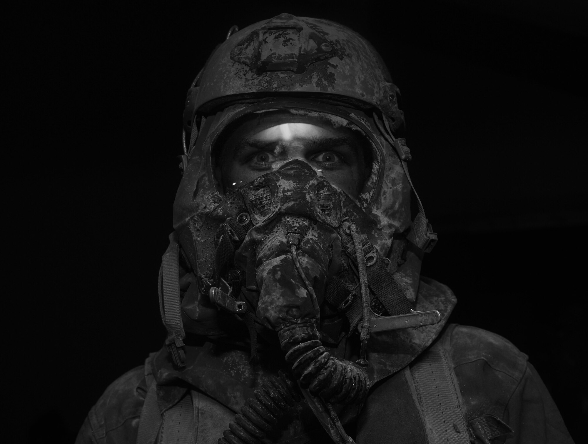 An aircrew member goes through a simulated decontamination line at Hurlburt Field, Fla., June 9, 2016. Air Force Special Operations Command’s operations directorate ran a realistic, scenario-based, training program for 16 Airmen from eight southern United States bases. (U.S. Air Force photo/Staff Sgt. Melanie Holochwost)