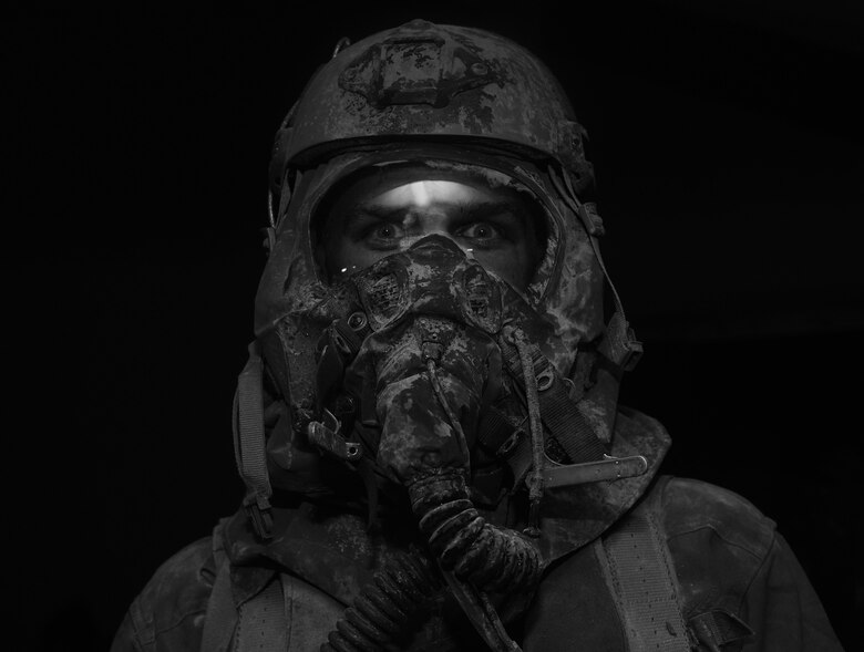 An aircrew member goes through a simulated decontamination line at Hurlburt Field, Fla., June 9, 2016. Air Force Special Operations Command’s operations directorate ran a realistic, scenario-based, training program for 16 Airmen from eight southern United States bases. (U.S. Air Force photo/Staff Sgt. Melanie Holochwost)