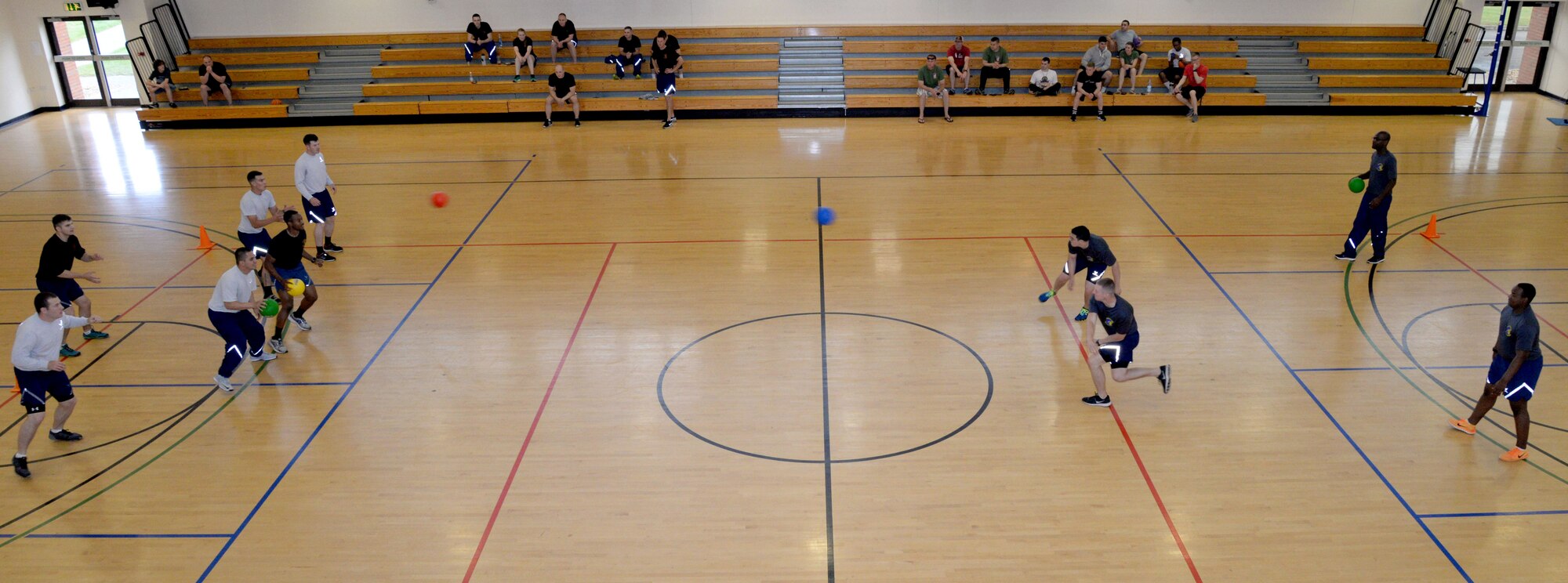 U.S. Air Force Airmen compete for first place in a dodgeball tournament at the Hardstand Fitness Center June 16, 2016, on RAF Mildenhall. The 2016 Marauder Melee Family Sports Day allowed Airmen to represent their squadrons by competing in various sports across the base. Other sports events included volleyball, basketball, bowling and tug-of-war. (U.S. Air Force photo by Senior Airman Justine Rho/Released) 