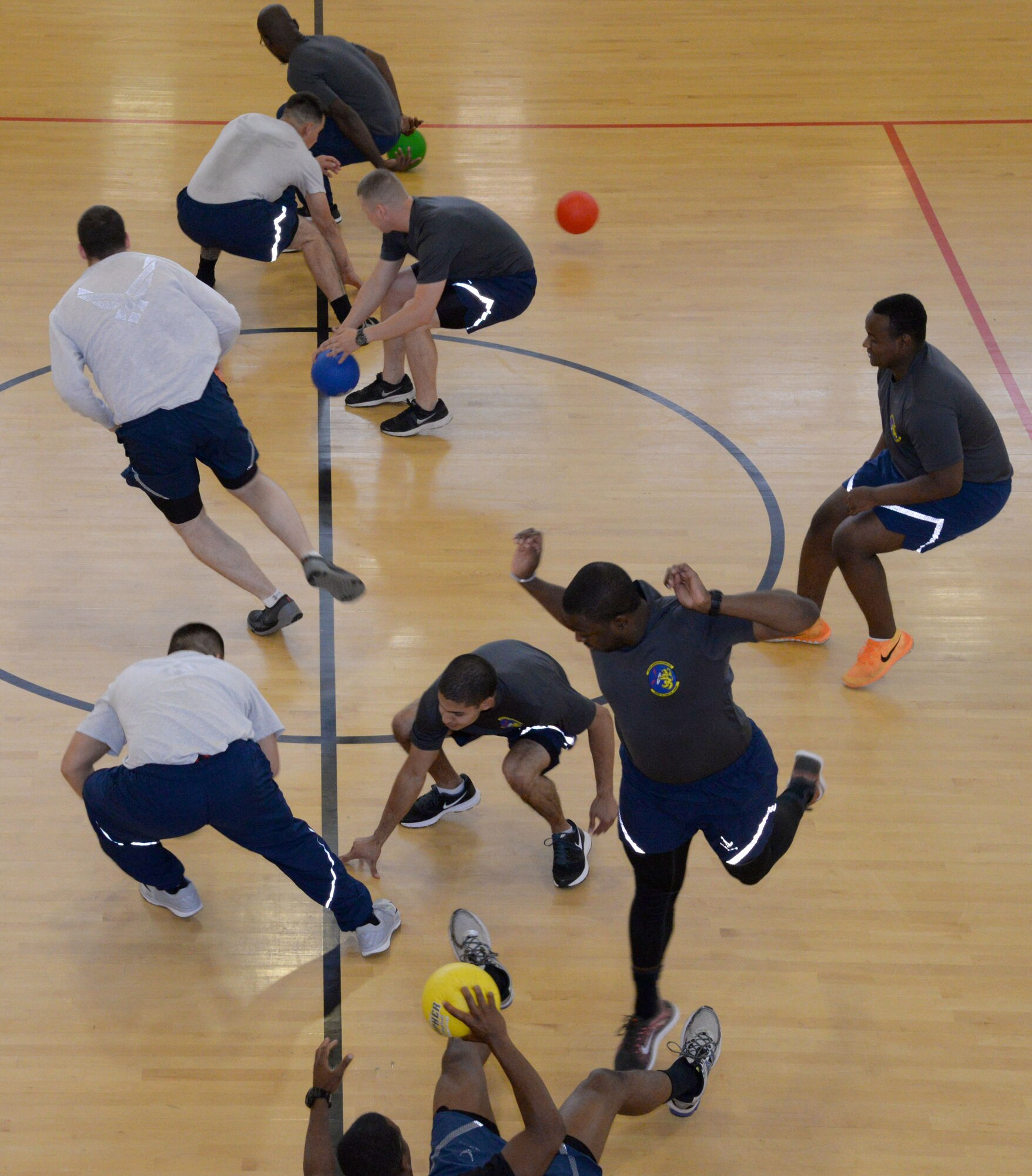 U.S. Air Force Airmen compete for first place in a dodgeball tournament at the Hardstand Fitness Center June 16, 2016, on RAF Mildenhall. The 2016 Marauder Melee Family Sports Day allowed Airmen to represent their squadrons by competing in various sports across the base. Other sports events included volleyball, basketball, bowling and tug-of-war. (U.S. Air Force photo by Senior Airman Justine Rho/Released) 