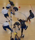 U.S. Air Force Airmen compete for first place in a dodgeball tournament at the Hardstand Fitness Center June 16, 2016, on RAF Mildenhall. The 2016 Marauder Melee Family Sports Day allowed Airmen to represent their squadrons by competing in various sports across the base. Other sports events included volleyball, basketball, bowling and tug-of-war. (U.S. Air Force photo by Senior Airman Justine Rho/Released) 