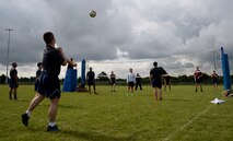 U.S. Air Force Airmen compete in an outdoor volleyball tournament as part of the 2016 Marauder Melee Family Sports Day June 16, 2016, on RAF Mildenhall. Squadron teams aimed to place top three in each event to accumulate the most points. Other sports events included ping pong, basketball, bowling and tug-of-war. (U.S. Air Force photo by Senior Airman Justine Rho/Released)  