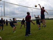 U.S. Air Force Airmen compete in an outdoor volleyball tournament as part of the 2016 Marauder Melee Family Sports Day June 16, 2016, on RAF Mildenhall. Squadron teams aimed to place top three in each event to accumulate the most points. Other sports events included ping pong, basketball, bowling and tug-of-war. (U.S. Air Force photo by Senior Airman Justine Rho/Released)  