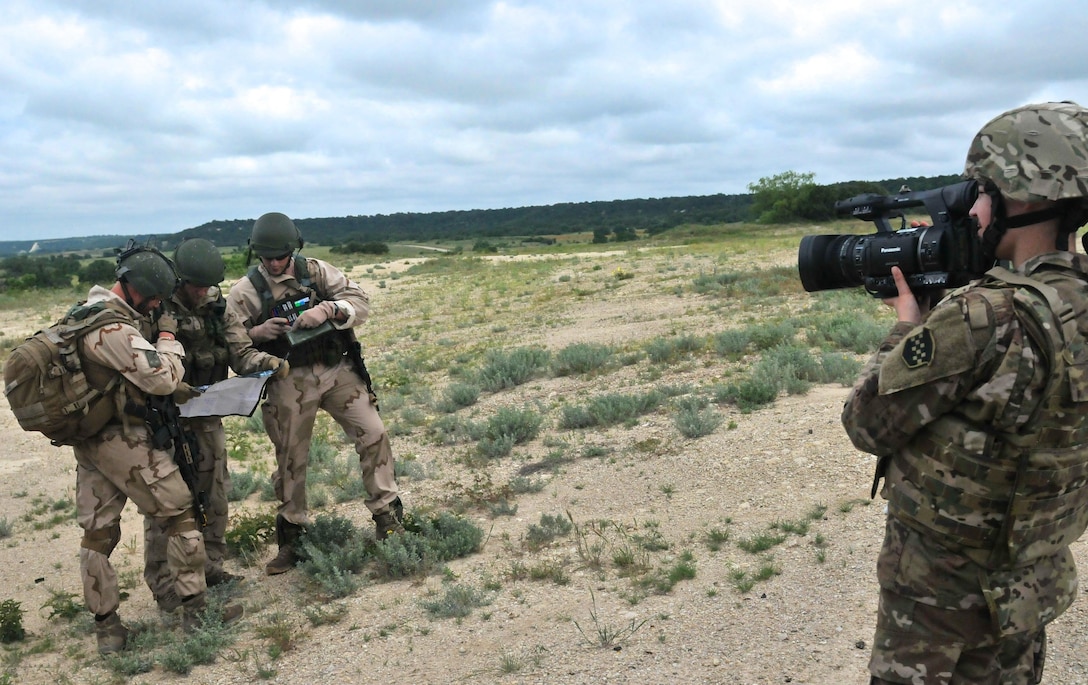 FORT HOOD, Texas – Sgt. Jessica Forester, a broadcast operations specialist with the 204th Public Affairs Detachment, records video footage of Dutch Soldiers assigned to the 302nd Dutch Aviation Squadron during multi-faceted training operations May 17 at Fort Hood, Texas. Three U.S. Army journalists assigned to the 204th PAD from Orlando, Fla., embedded with a company of Dutch Soldiers to cover training missions while simulating actual media embeds. (U.S. Army photo by Sgt. Aaron Ellerman, 204th Public Affairs Detachment, 99th RSC)