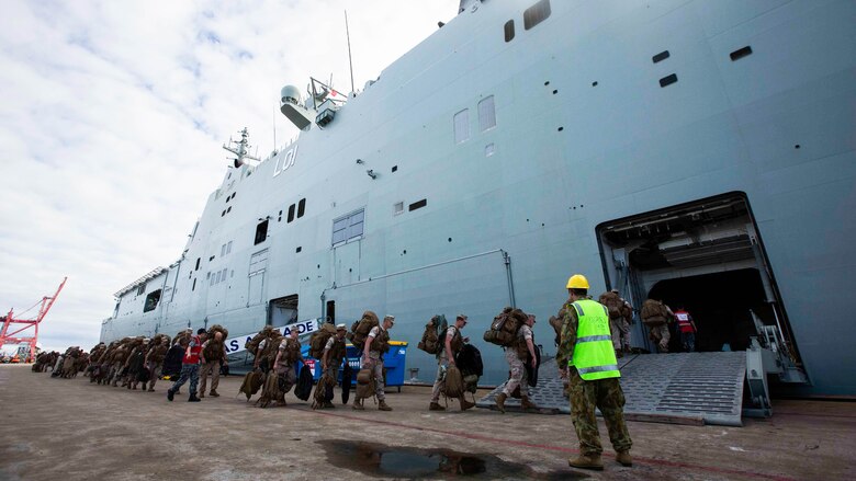 U.S. Marines go aboard the HMAS Adelaide at Port of Brisbane, Queensland, Australia, June 16, 2016. This marks the first time Marines and sailors from Marine Rotational Force - Darwin have embarked in such numbers on an Australian HMAS. This opportunity allows for MRF-D to expand the partnership capabilities with our Australian allies. The Marines are with 1st Battalion, 1st Marine Regiment, MRF-D, and the Australians are with HMAS Adelaide. 
