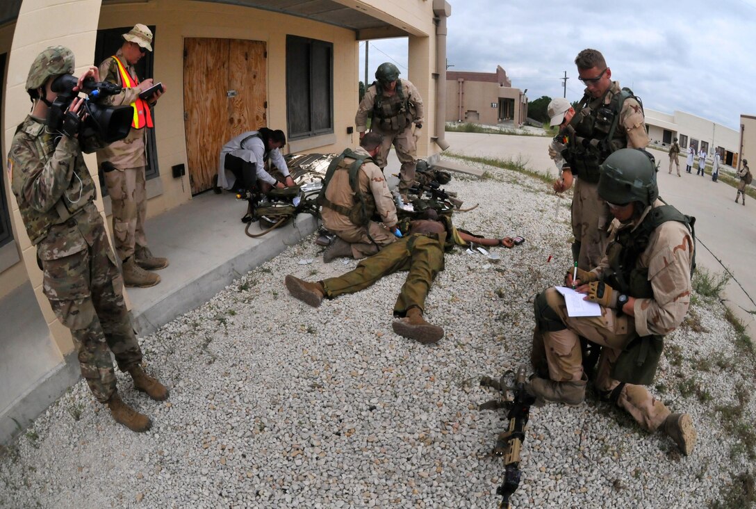 FORT HOOD, Texas – Sgt. Jessica Forester, a broadcast operations specialist with the 204th Public Affairs Detachment, records video footage of Dutch Soldiers assigned to the 302nd Dutch Aviation Squadron during multi-faceted training operations May 17 at Fort Hood, Texas. Three U.S. Army journalists assigned to the 204th PAD from Orlando, Fla., embedded with a company of Dutch Soldiers to cover training missions while simulating actual media embeds. (U.S. Army photo by Sgt. Aaron Ellerman, 204th Public Affairs Detachment, 99th RSC)