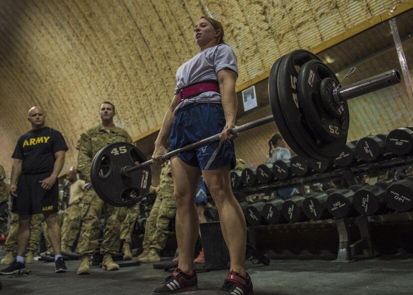 Master Sgt. Lindsey Glover, 455th Expeditionary Aircraft Maintenance Squadron, competes in a deadlift portion of Bagram’s Strongest Woman and Man competition, June 18, 2016, Bagram Airfield, Afghanistan. Glover won the overall competition for squat, bench, and deadlift, women’s division. (U.S. Air Force photo by Senior Airman Justyn M. Freeman)