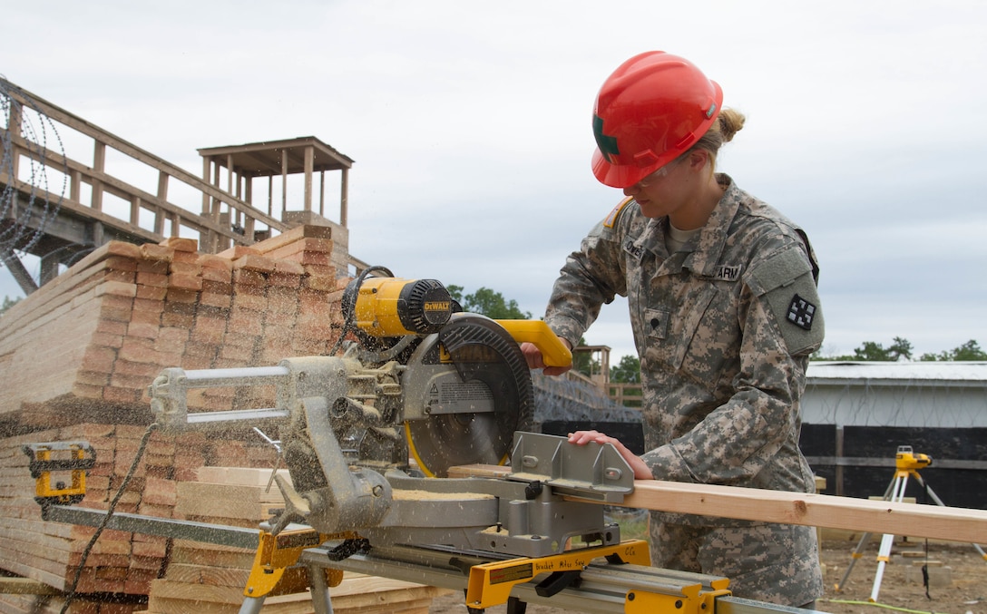 JOINT BASE MCGUIRE-DIX-LAKEHURST, N.J. - Hazleton, Pa. native Spc. Chiarra Overpeck of 412th Engineer Company, based in Scranton, Pa., cuts wood for a frame for a detainee complex during training exercise Castle Installation Related Construction 2016. (U.S. Army photo by Spc. Gary R. Yim, 372nd Mobile Public Affairs Detachment)