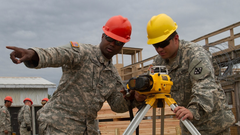 JOINT BASE MCGUIRE-DIX-LAKEHURST, N.J. - Binghamton, N.Y. native Sgt. David Nash of 412th Engineer Company, based in Scranton, Pa., teaches West Scranton, Pa. native Pvt. Jeff Ohara how to use a laser level during training exercise Castle Installation Related Construction 2016. (U.S. Army photo by Spc. Gary R. Yim, 372nd Mobile Public Affairs Detachment)