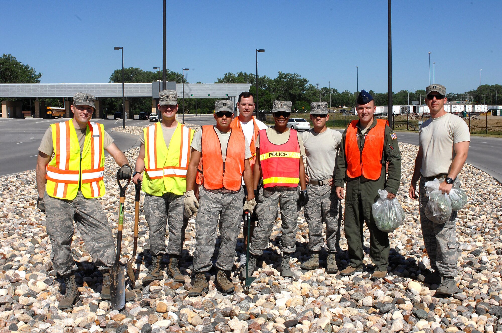 Members of the Company Grade Officers Club pose for a picture after doing volunteer work near the STRATCOM gate June 15 as part of the Installation Pride Initiative. (U.S. Air Force photo by Delanie Stafford/Released)