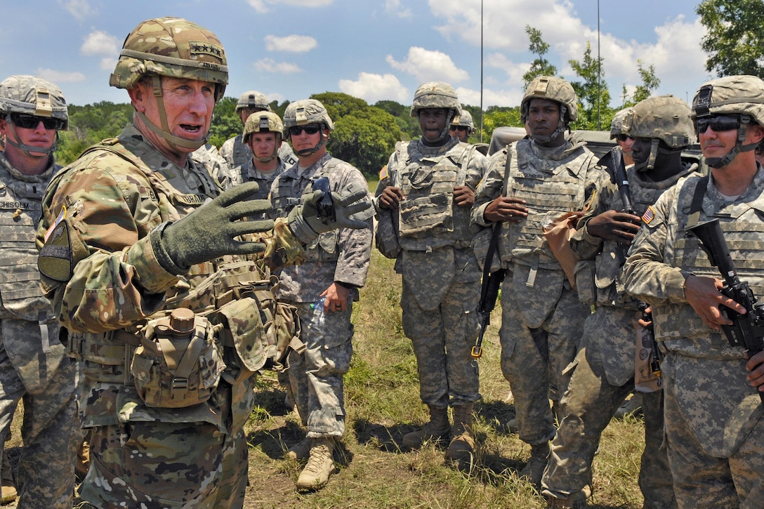 Army Gen. Robert B. Abrams, foreground left, commander of U.S. Army Forces Command, speaks to Army National Guardsmen about the Guard’s importance in the Army's Total Force policy during a training exercise at Fort Hood, Texas, June 8, 2016. The soldiers are assigned to the Mississippi Army National Guard’s 114th Field Artillery Regiment, 155th Armored Brigade Combat Team. Mississippi Army National Guard photo by Staff Sgt. Shane Hamann