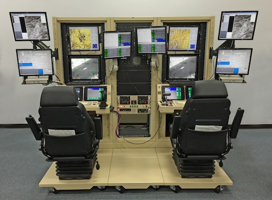 The Predator mission aircrew training systems lite is a condensed version of a full-sized simulator, which allows Airmen who work with the MQ-9 Reaper to replicate an active environment, and exercise launch and recovery, and full-mission operations. With help from the 28th Communications and Civil Engineer Squadrons, the 432nd Attack Squadron is able to save $150,000 and 7,800 man-hours a year. (U.S. Air Force photo/Lt. Col. Kenneth Degon)
